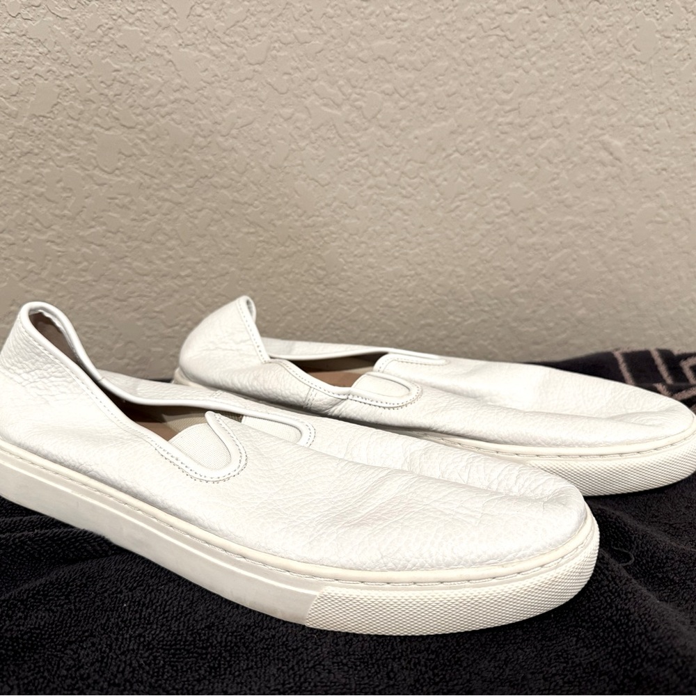 White leather boat shoes women size 11 or men’s size 9.